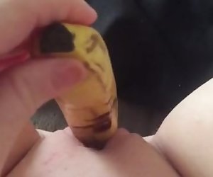 Teen fucks her tight little pussy with a banana  squirts everywhere