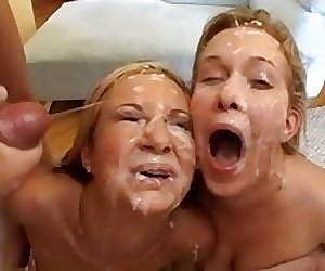 Two girls share a lot of cumshots in bukkake